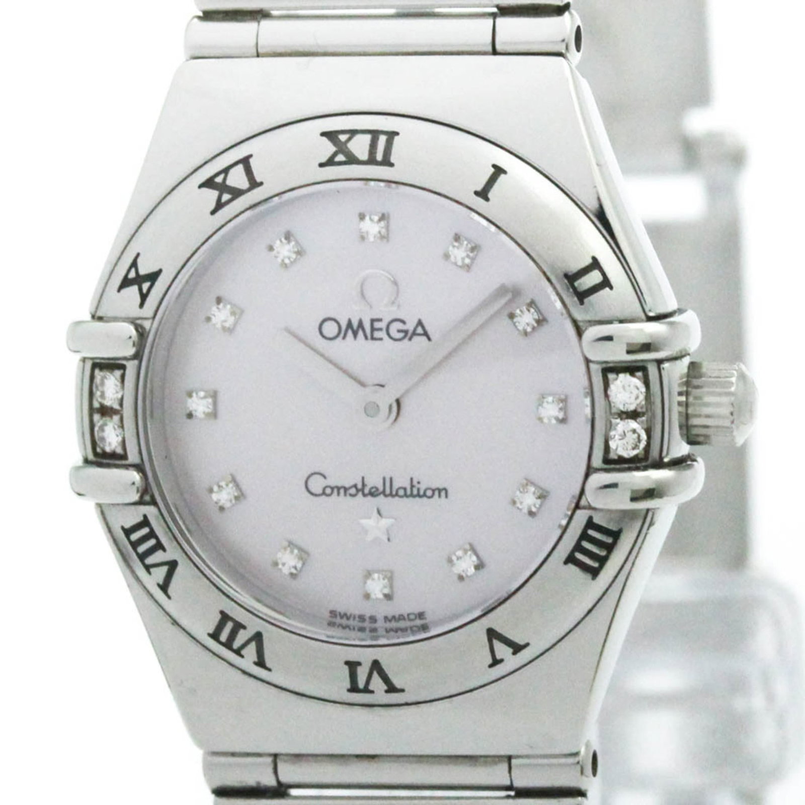 Omega Wristwatch: Omega Wristwatch Stainless steel case and band provide a sleek, modern look, while the pink shell dial adds a touch of elegance. This quartz-powered Omega Constellation watch features a 22mm diameter 