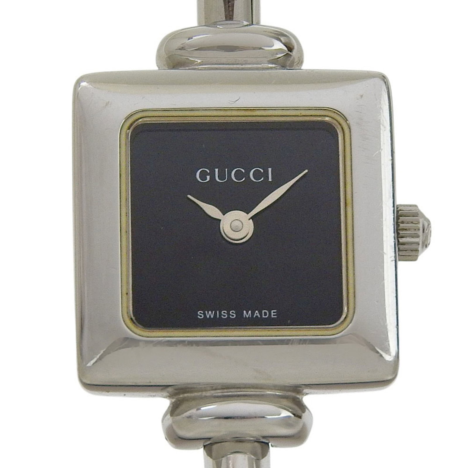 Gucci Wristwatch: Gucci Wristwatch Stainless steel case and band add a sleek touch to this black quartz wristwatch, measuring 19mm in diameter. The 16.5cm long strap accommodates wrists of various sizes, making it a ve
