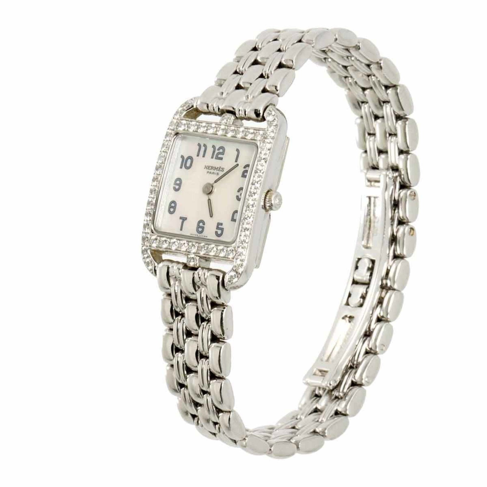 Hermes Wristwatch: Hermes Wristwatch White gold (18K) case and band, a classic combination, complement the white shell dial of this Herm?s wristwatch. The quartz movement keeps time with precision, while the 19mm case d