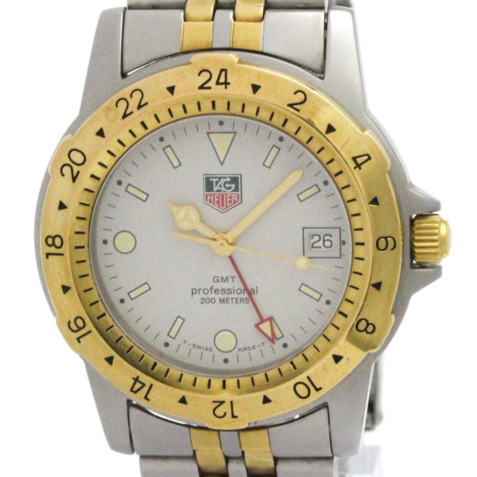 Tag Heuer Wristwatch: Tag Heuer Wristwatch The Tag Heuer 155.706 is a sleek and sporty gold plated, stainless steel wristwatch with a silver dial, featuring a quartz movement and date, GMT functions. Weighing in at just 10