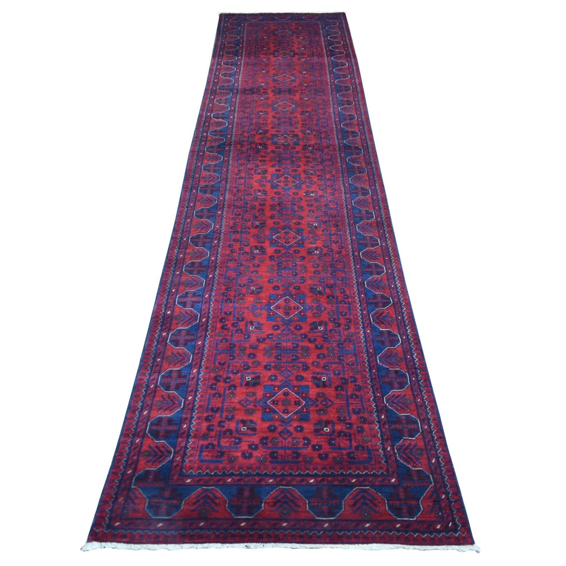 2'10"x12'8" Deep Red Afghan Khamyab Pure Wool Hand Knotted Runner Rug: 2'10"x12'8" Deep Red Afghan Khamyab Pure Wool Hand Knotted Runner Rug Deep red hues dominate this stunning 2'10"x12'8" Afghan hand-knotted wool runner rug, showcasing a traditional Oriental regional d