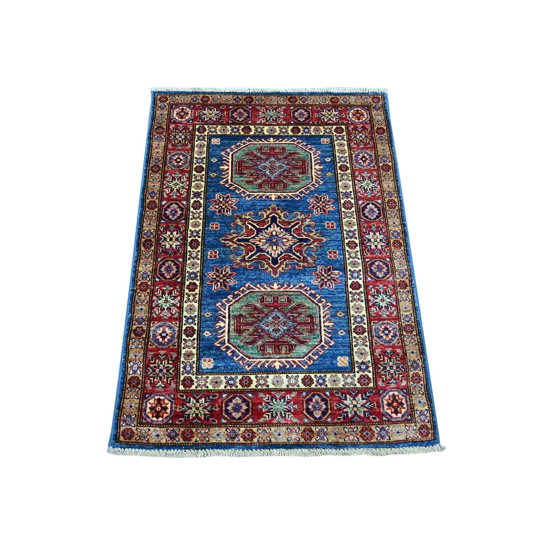 2'10"x4' Blue Afghan Super Kazak Hand Knotted Wool Sample Mat Rug: 2'10"x4' Blue Afghan Super Kazak Hand Knotted Wool Sample Mat Rug The 2'10"x4' Blue Afghan Super Kazak Hand Knotted Wool Sample Mat Rug is a stunning example of traditional Afghan craftsmanship, featu