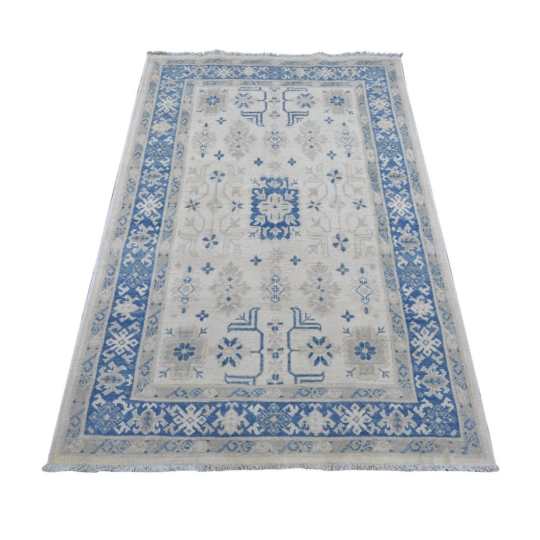 3'10"x5'6" Ivory Vintage Look Kazak Floral Elements Wool Hand Knotted Rug: 3'10"x5'6" Ivory Vintage Look Kazak Floral Elements Wool Hand Knotted Rug The 3'10"x5'6" Ivory Vintage Look Kazak Floral Elements Wool Hand Knotted Rug is a stunning, all-over regional design featurin