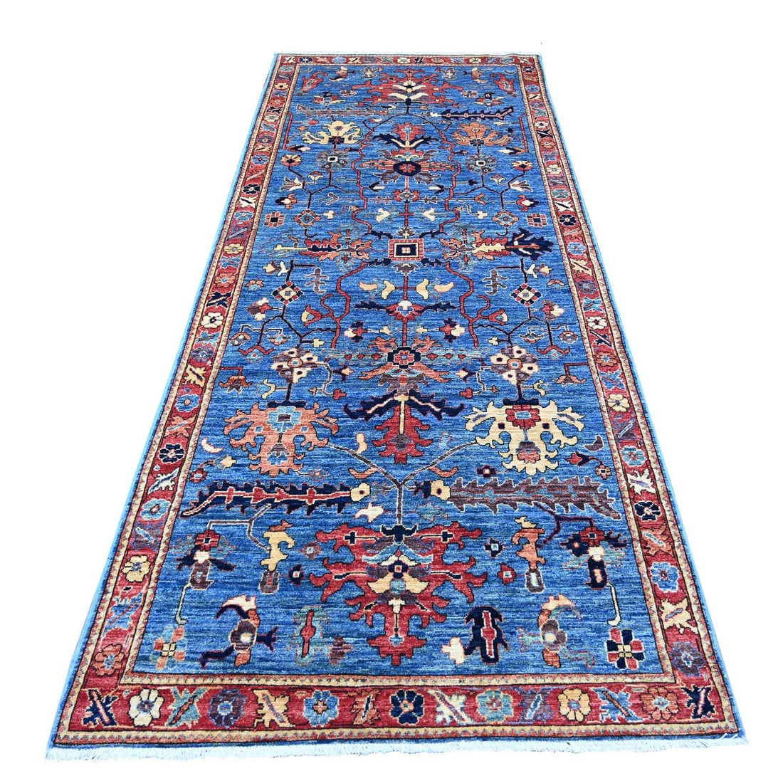 Blue Heris All Over Design Hand Knotted Wool 4'1"x10' Oriental Rug: Blue Heris All Over Design Hand Knotted Wool 4'1"x10' Oriental Rug Hand-knotted in Afghanistan, this stunning Blue Heris all-over design wool runner rug boasts a rich, vibrant blue field with intricat