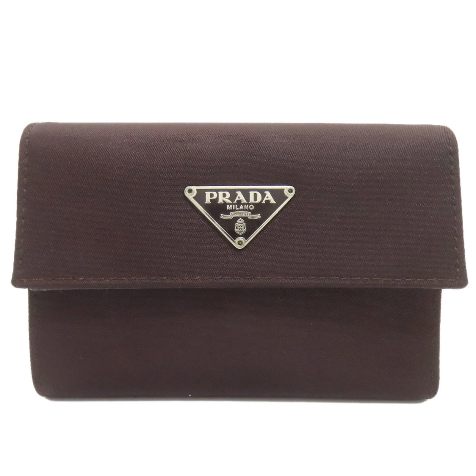 Nylon Prada Wallet Bi Fold: Nylon Prada Wallet Bi Fold Dark brown nylon bi-fold wallet from Prada, measuring 8cm x 12cm x 2cm. This compact wallet features a durable nylon material and a classic bi-fold design. Item Specifics: