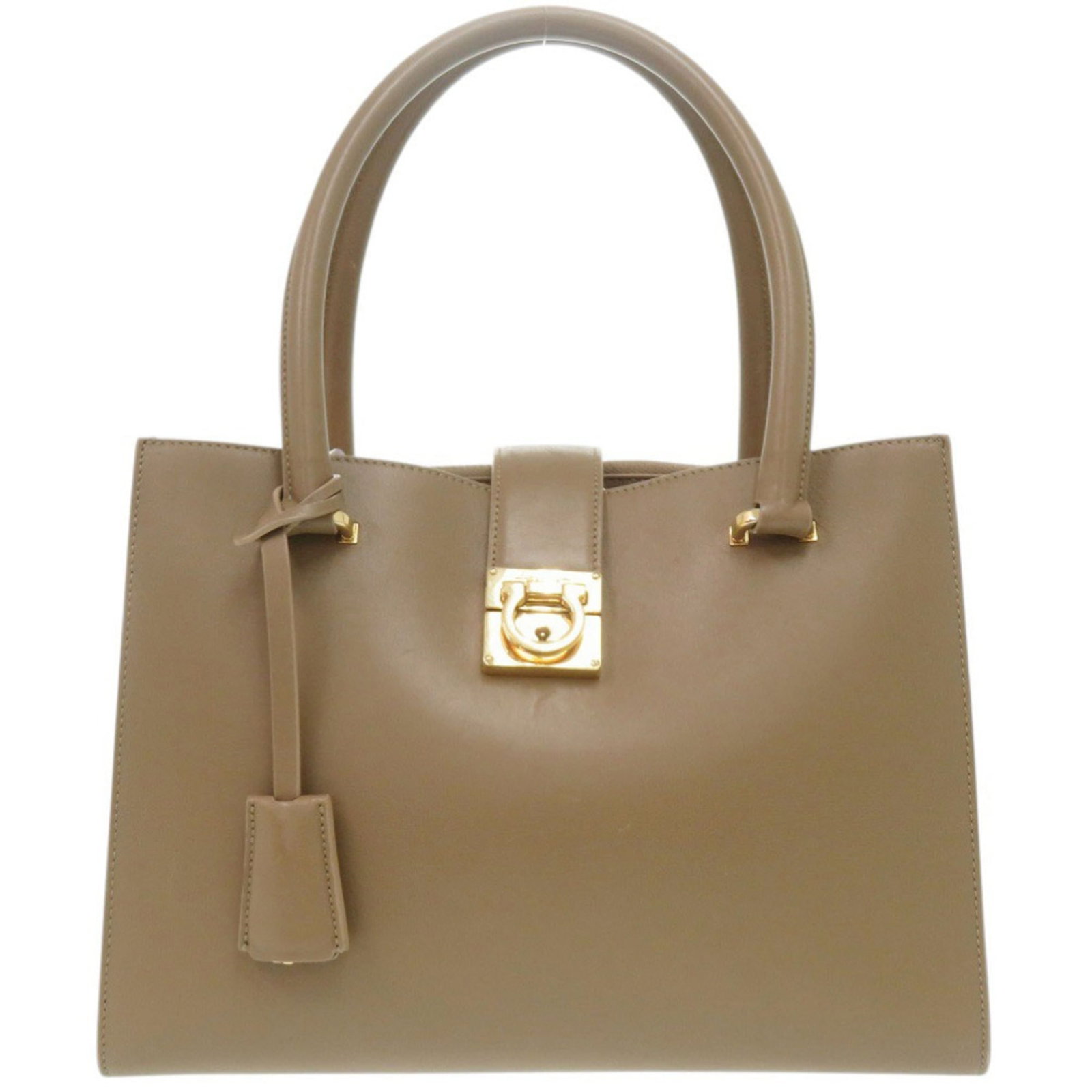Salvatore Ferragamo Handbag Leather: Salvatore Ferragamo Handbag Leather Brown and red leather Salvatore Ferragamo handbag with dimensions 19cm x 26.5cm x 12cm. This Italian-made leather handbag features the iconic Ferragamo style,
