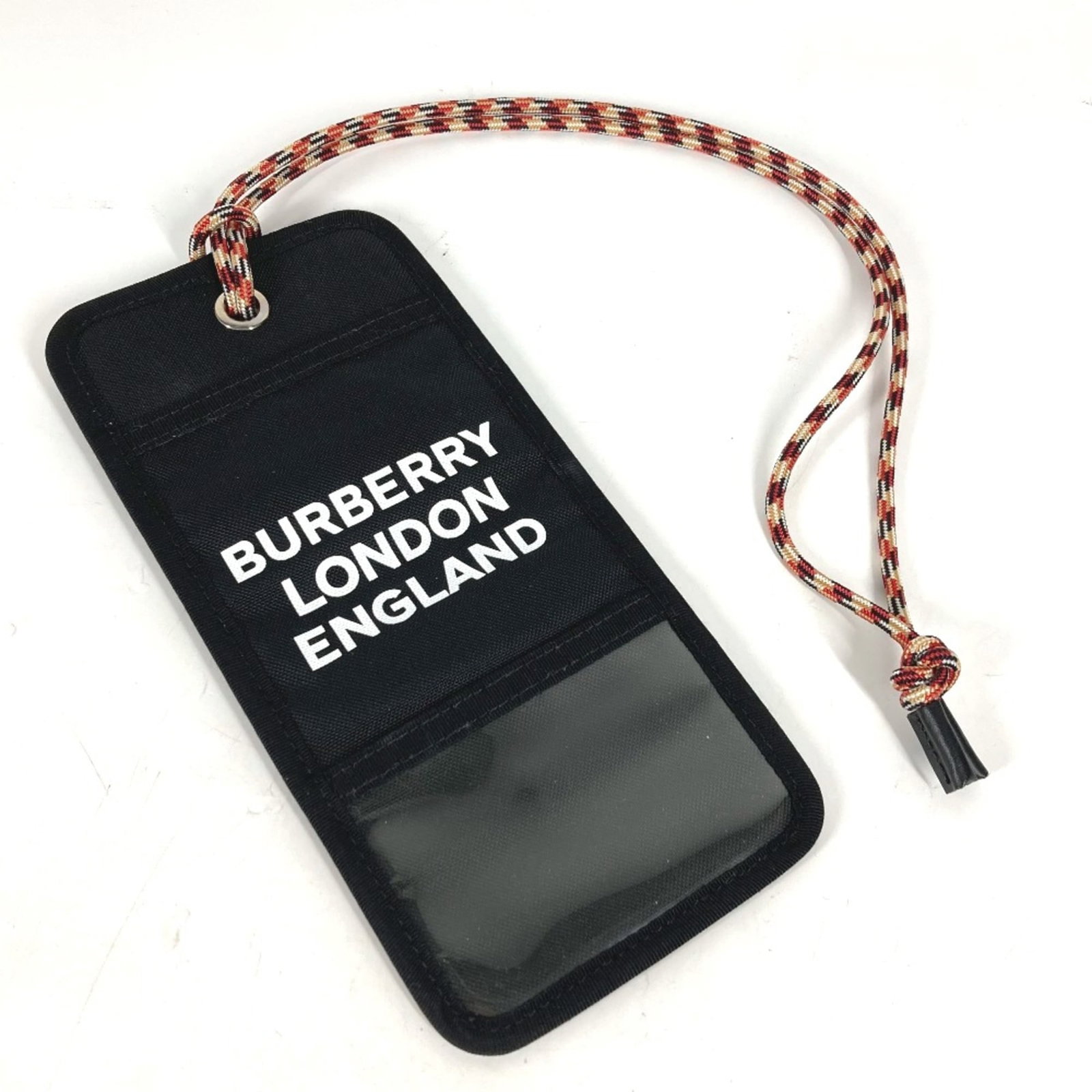 Card case cloth Burberry: Card case cloth Burberry Black cloth card case from Burberry, measuring 10.8cm x 22.5cm and 4.3cm x 8.9cm. This card case bears a signature, adding a touch of personal style to your daily essentials.