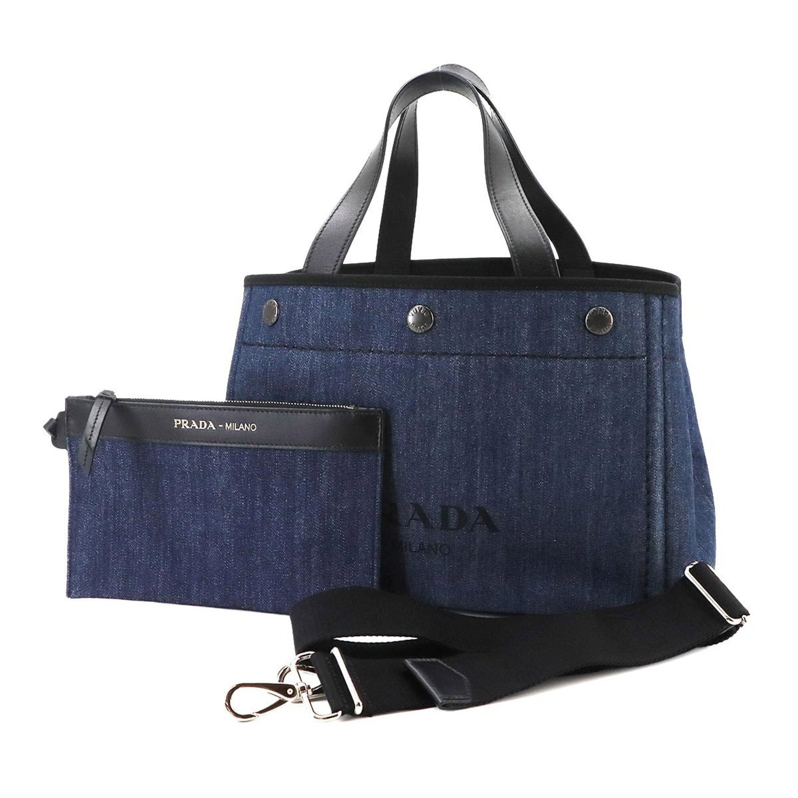 Shoulder Bag Denim Leather Prada Handbag: Shoulder Bag Denim Leather Prada Handbag Denim and leather blend in this sleek shoulder bag from Prada, crafted in Italy with a black and blue color scheme. Measuring 20.5cm x 31.5cm x 17cm, the bag