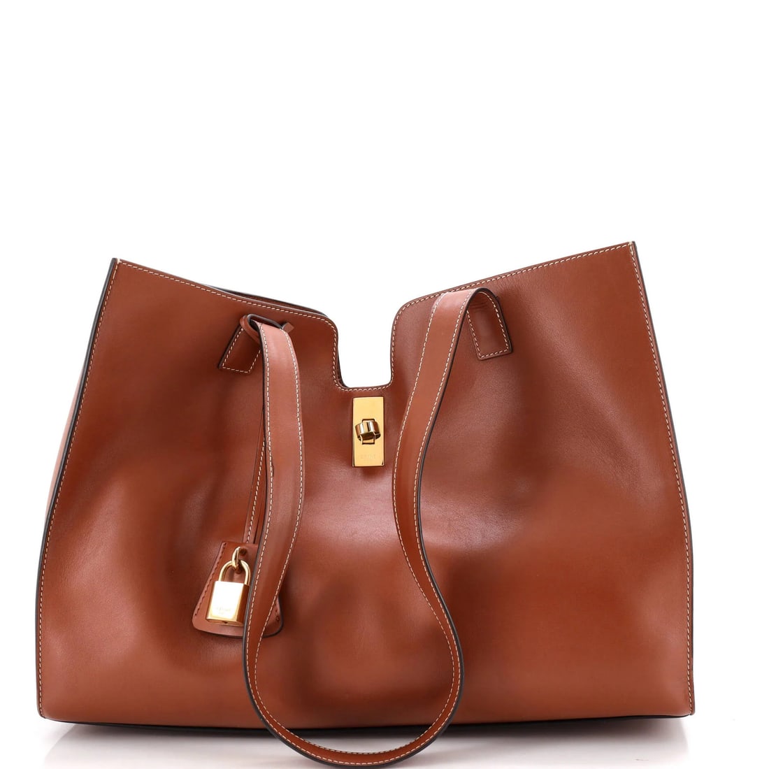 Calfskin bag smooth 16 Celine Cabas: Calfskin bag smooth 16 Celine Cabas Smooth Calfskin Celine Cabas 16 in Brown. This great condition bag features a classic Cabas design with a smooth, brown calfskin exterior and gold hardware. With it