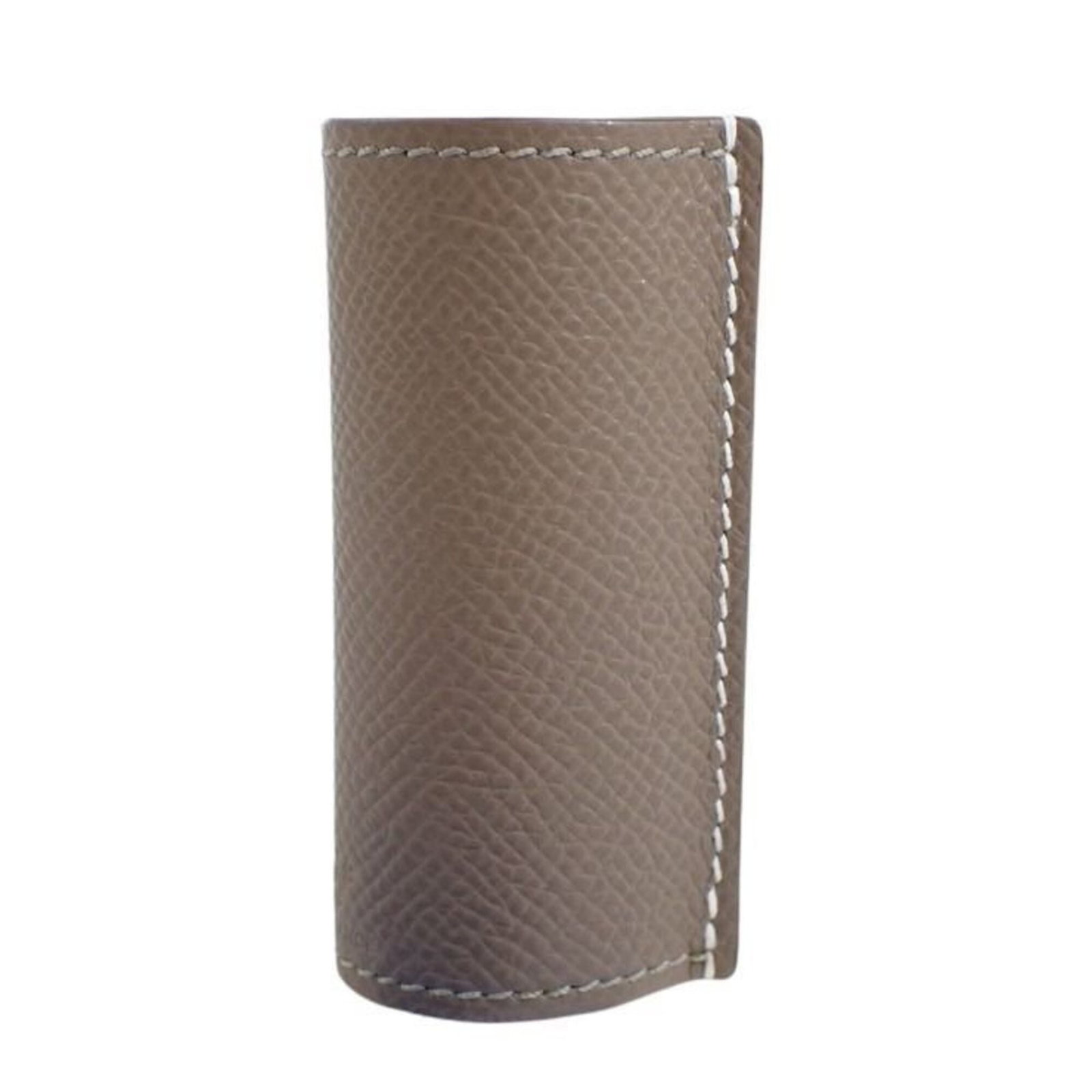 Lipstick Case Leather By Hermes: Lipstick Case Leather By Hermes Etoupe gray Epsom leather lipstick case from iconic French brand Hermes, measuring 7cm x 3.5cm. This sleek, compact case is crafted from high-quality leather, offering