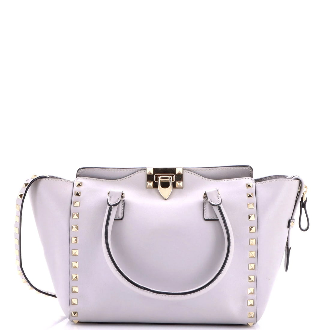 Tote rigid leather small Valentino Garavani Rockstud: Tote rigid leather small Valentino Garavani Rockstud Small rigid leather tote from Valentino Garavani's Rockstud collection, featuring a sleek gray exterior and neutral interior. The item boasts a