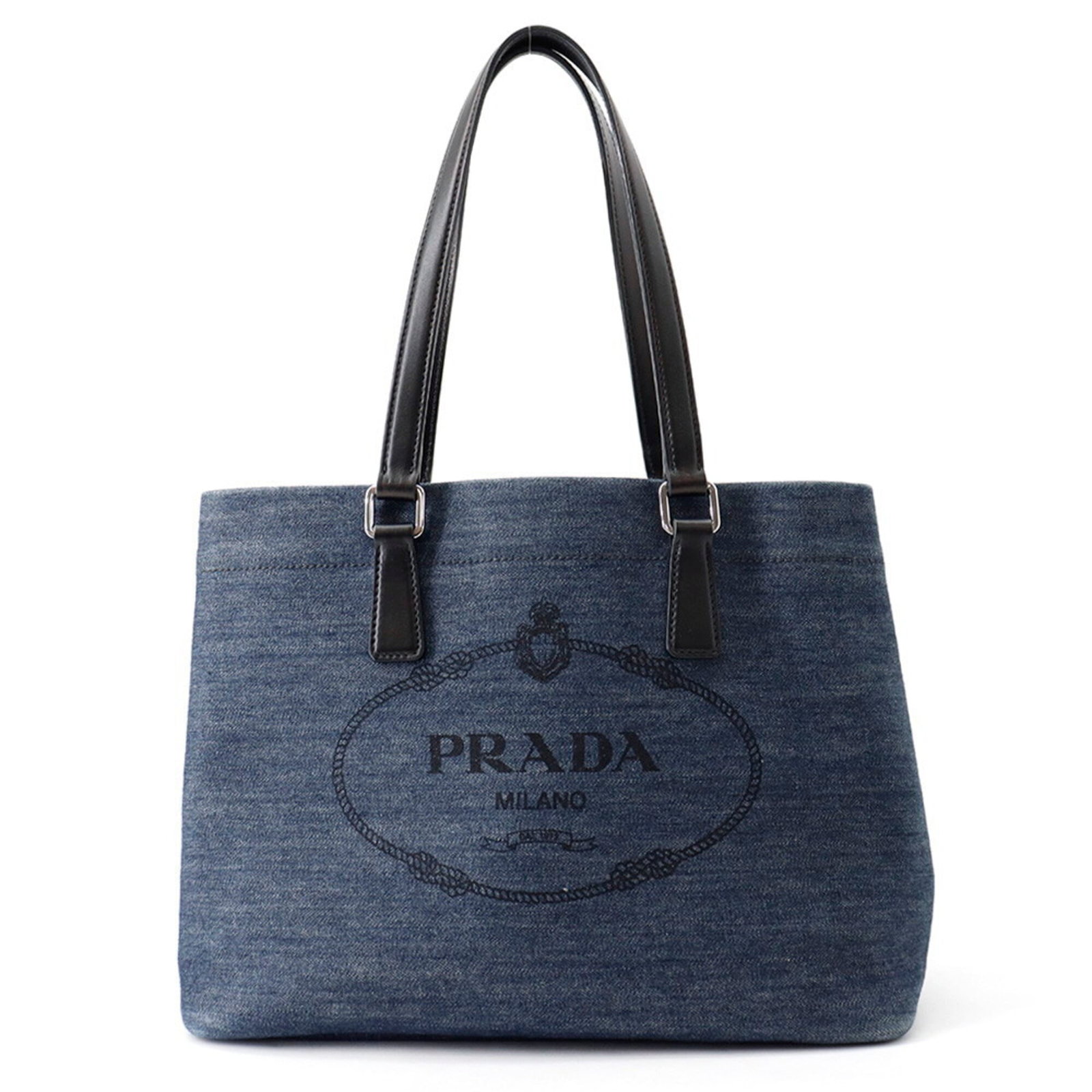Cotton Leather Tote Bag Prada Shoulder Bag: Cotton Leather Tote Bag Prada Shoulder Bag Cotton and leather blend creates a unique and stylish shoulder tote bag from Prada, available in black and blue colors. Measuring 24cm x 31cm x 14.5cm, this 