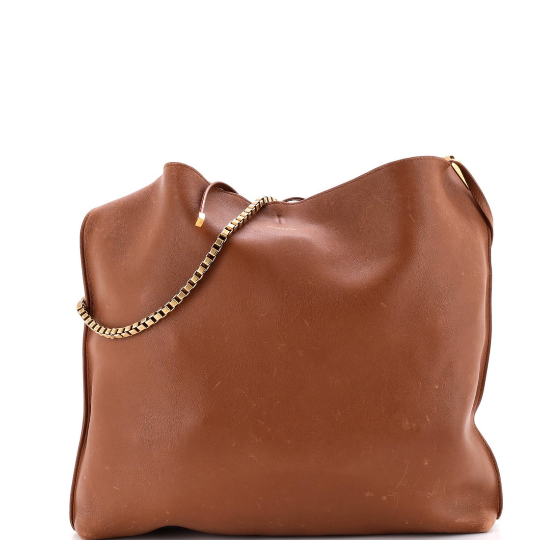 Suzanne Saint Laurent Medium Leather Hobo: Suzanne Saint Laurent Medium Leather Hobo Suzanne Saint Laurent Medium Leather Hobo is a medium-sized leather hobo with a brown exterior and suede interior, featuring a gold hardware. The exterior sho