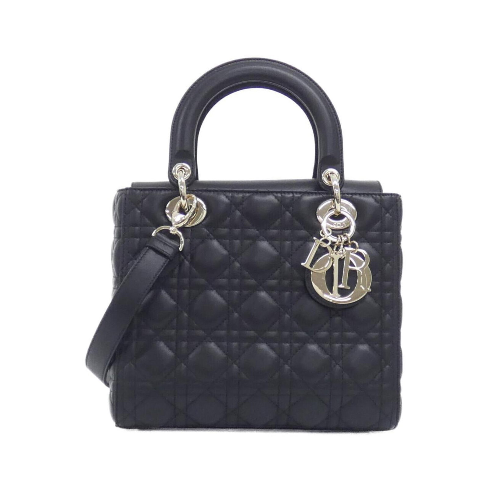 Handbag Leather Dior Christian: Handbag Leather Dior Christian Handbag made from high-quality lambskin leather, featuring a sleek black design with gold hardware. Measuring 20cm x 24cm x 12cm, this Lady Dior handbag is a stylish