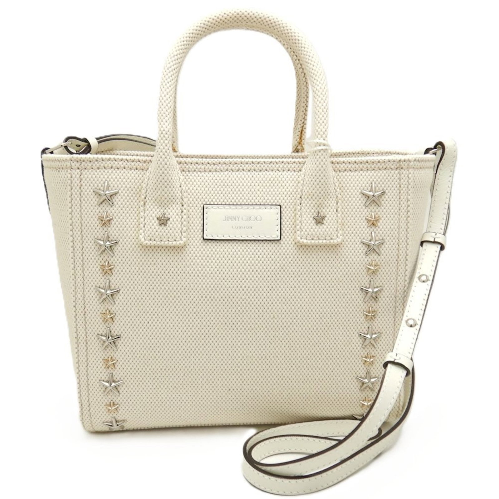 Canvas Handbag Jimmy Choo: Canvas Handbag Jimmy Choo Canvas Handbag by Jimmy Choo, featuring a stylish gold and silver hardware combination, is a versatile and chic accessory for women. Measuring 19cm x 27cm x 11cm, this
