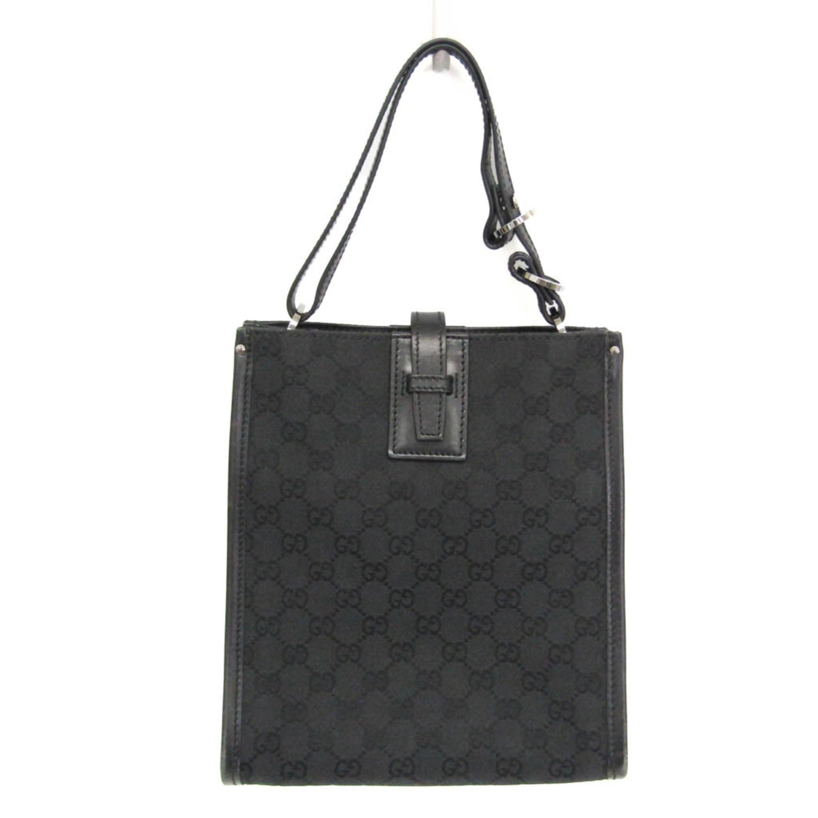 Shoulder Bag Gg Canvas: Shoulder Bag Gg Canvas Black GG Canvas Shoulder Bag with fastening belt closure and zipper pocket. Measuring 25.5cm x 23cm x 13cm, this Italian-made bag features a durable GG canvas material and a tot