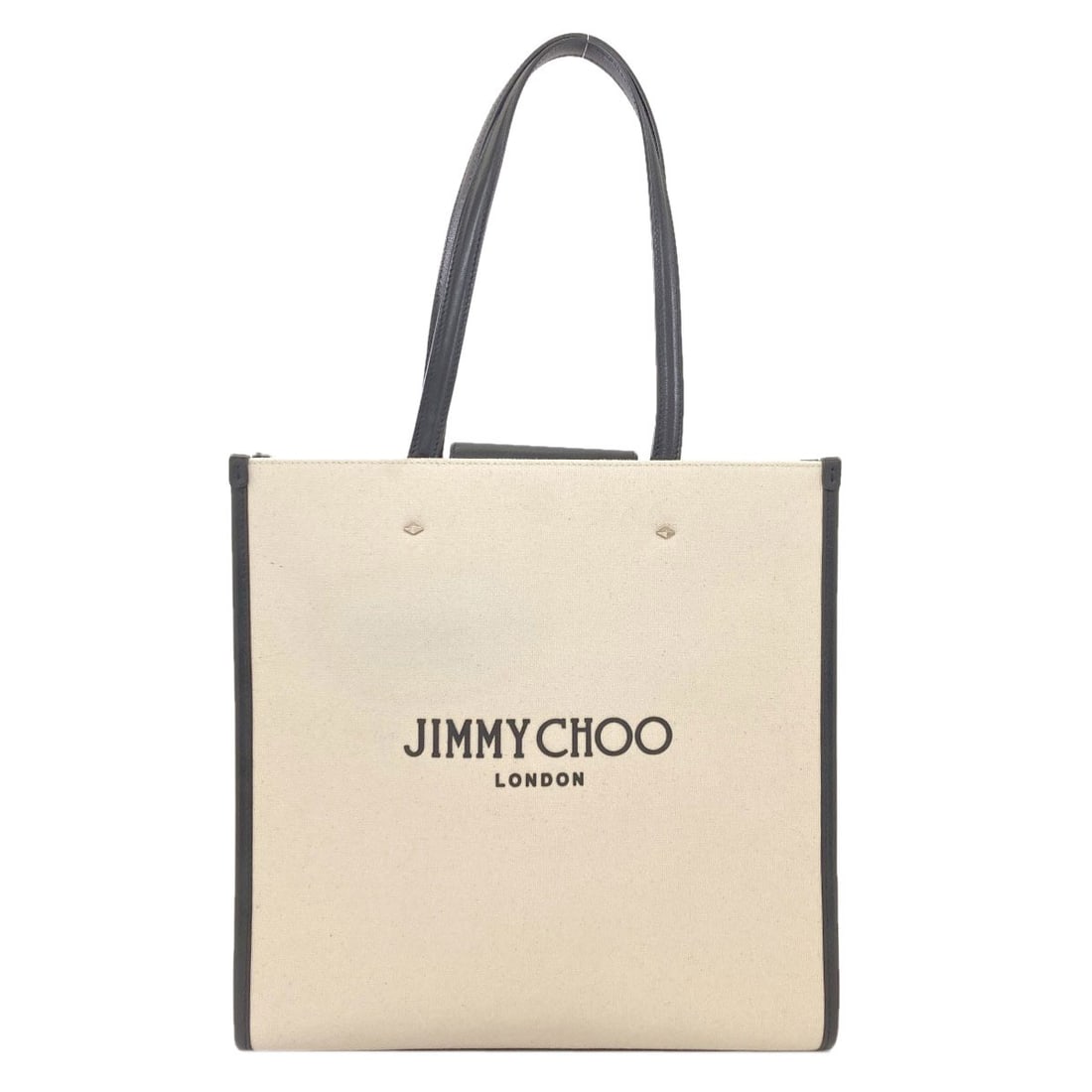 Canvas tote bag by Jimmy Choo: Canvas tote bag by Jimmy Choo White canvas tote bag by Jimmy Choo, featuring a classic design in a crisp white exterior. The canvas material provides a sturdy and durable finish, making it a