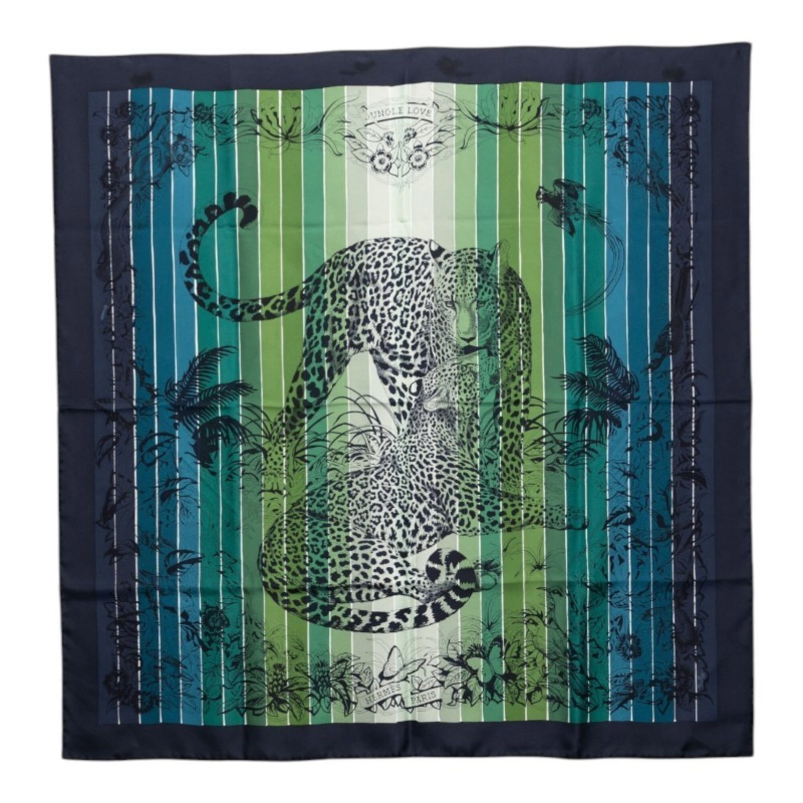 Silk Hermes Scarf: Silk Hermes Scarf Silk from the renowned French house, this 89cm x 88cm Hermes scarf is crafted from high-quality silk, featuring a striking green and multi-color design. The classic Hermes scarf desi