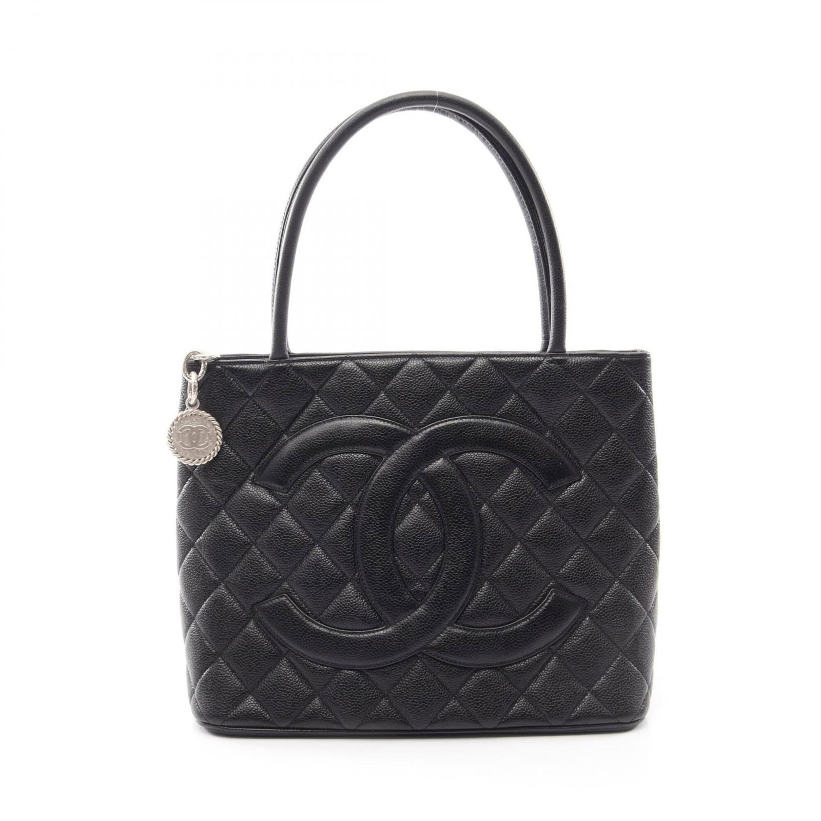 Calfskin Grained Chanel Tote Bag: Calfskin Grained Chanel Tote Bag Calfskin Grained Chanel Tote Bag in Black with Silver Hardware. This sleek, all-grained calfskin tote bag from Chanel features a classic design with clean lines and a