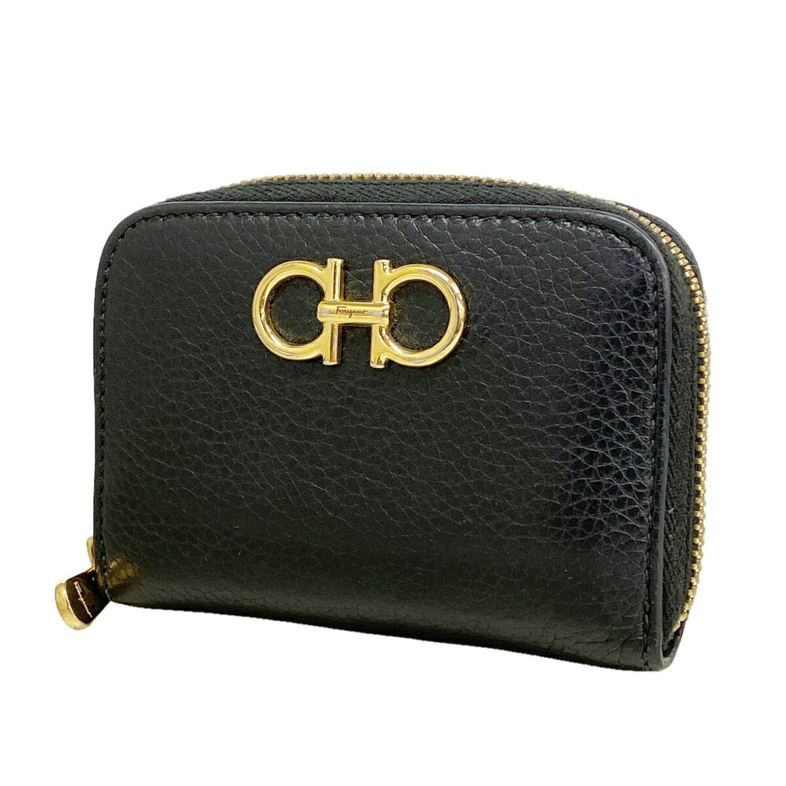 Salvatore Ferragamo Coin Purse/ Coin Case Leather: Salvatore Ferragamo Coin Purse/ Coin Case Leather The Salvatore Ferragamo Coin Purse/ Coin Case Leather is a sleek and sophisticated accessory, boasting a classic black leather design with precise
