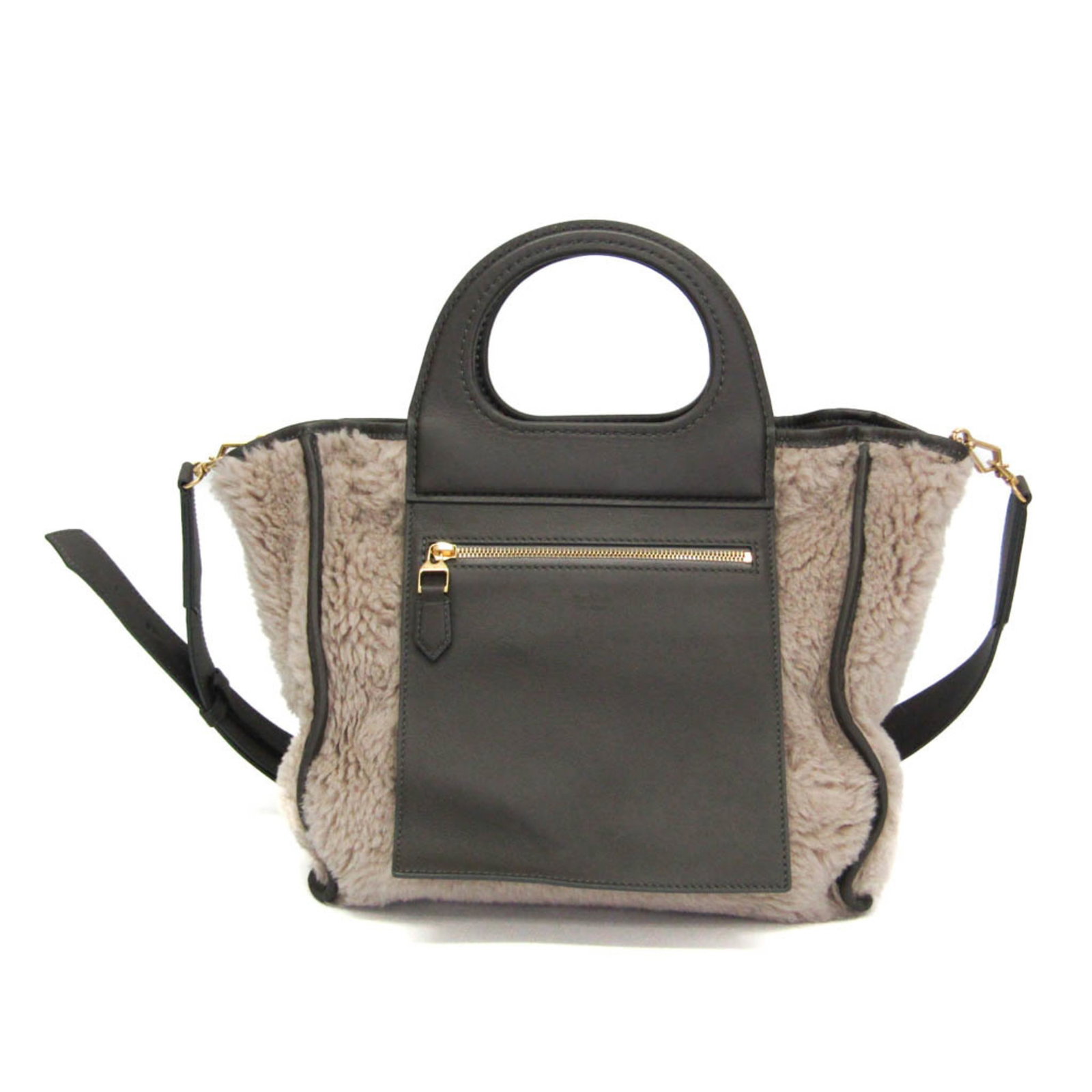 Max Mara Handbag Shoulder Bag Leather Wool Suede: Max Mara Handbag Shoulder Bag Leather Wool Suede The Max Mara Teddy Bear Reversible Tote Bag is a stylish and versatile shoulder bag made from high-quality leather, wool, and suede. Its reversible des