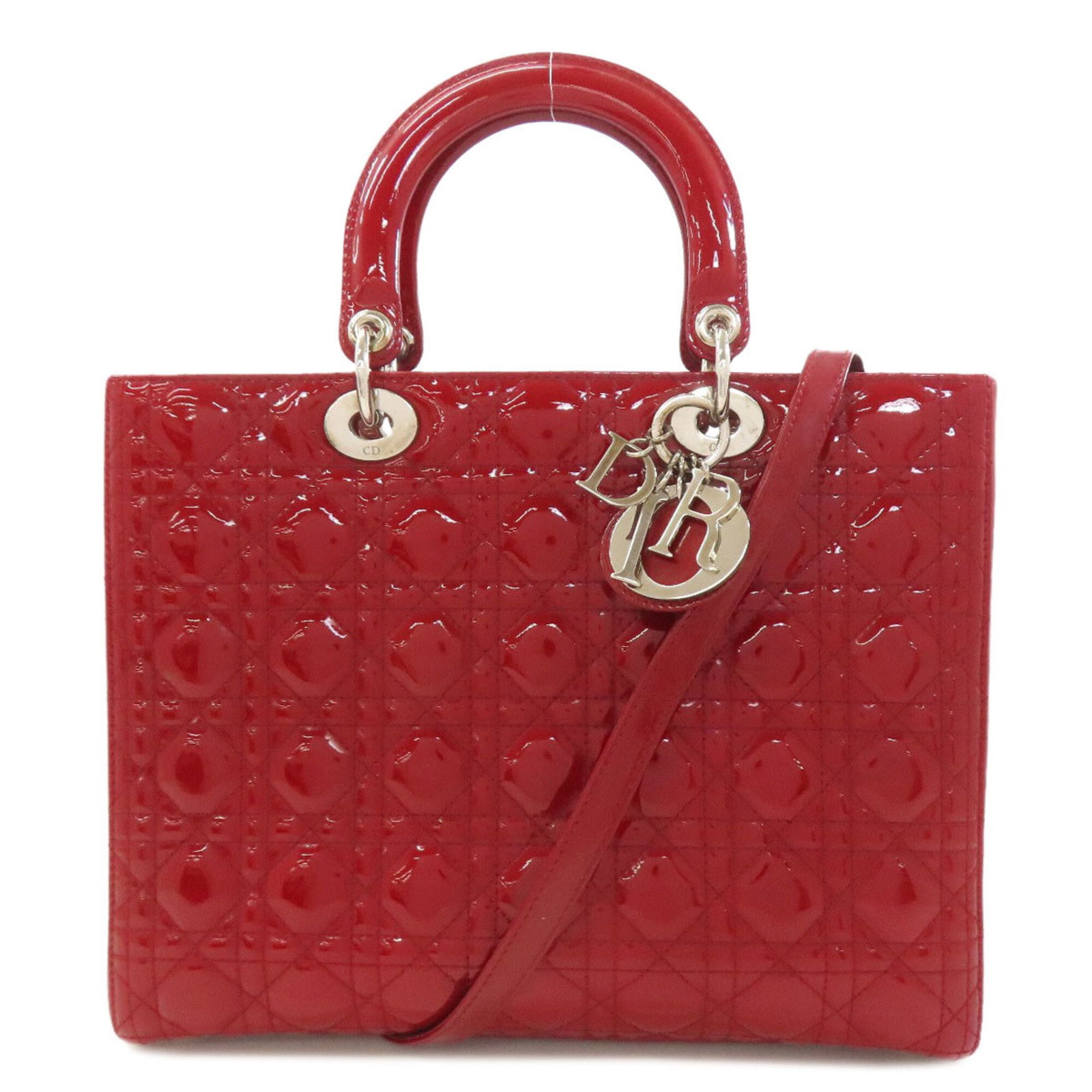 Handbag Leather Dior Christian: Handbag Leather Dior Christian This stunning Lady Dior handbag features a striking red leather exterior adorned with enamel details, showcasing a unique and eye-catching design. Measuring 25cm x 31cm