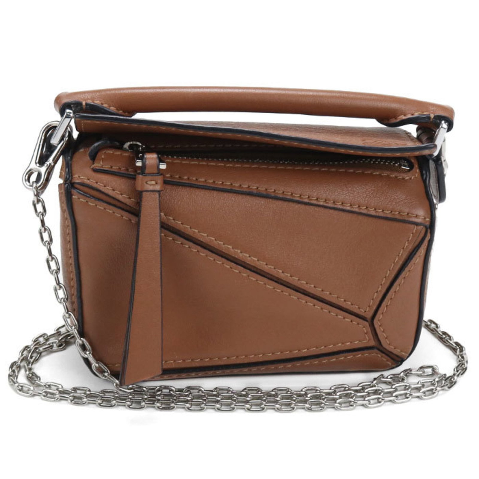 Handbag Leather Handbag: Handbag Leather Handbag This beautiful brown leather handbag is crafted from high-quality materials and features silver hardware. Measuring 9cm x 13cm x 5.5cm, it is a stylish and compact accessory pe
