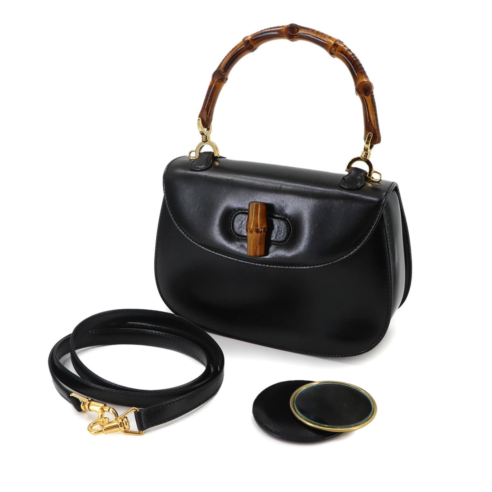 Handbag Leather Gucci: Handbag Leather Gucci Black leather Gucci handbag with dimensions 15cm x 22cm x 6.5cm. This Italian-made bag features a classic design with a sleek black leather exterior. The signature Gucci logo is