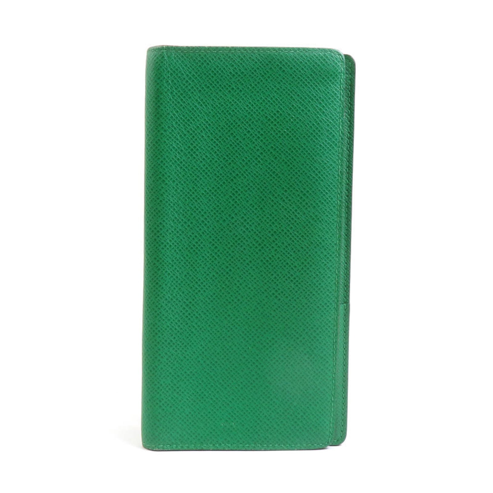Vuitton Long Wallet Bi Fold Taiga Leather: Vuitton Long Wallet Bi Fold Taiga Leather Taiga leather construction provides a premium feel to this bi-fold long wallet from Louis Vuitton, with a classic design that exudes timeless elegance. Measur