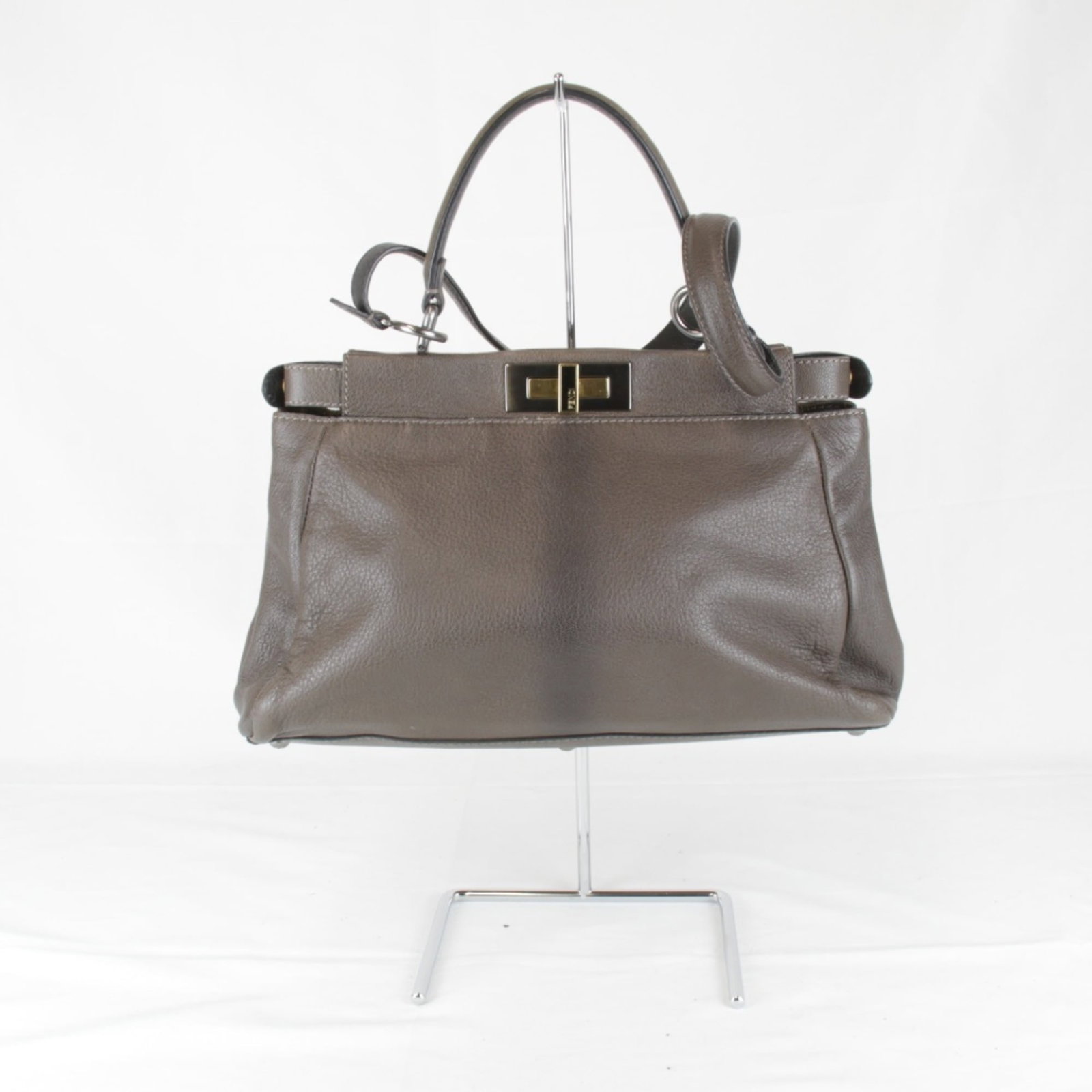 Handbag Leather Fendi: Handbag Leather Fendi Brown Fendi handbag made of leather, measuring 13cm x 34cm x 10cm. The bag's leather material and brown color provide a classic and timeless design. Item Specifics: Brand: Fendi