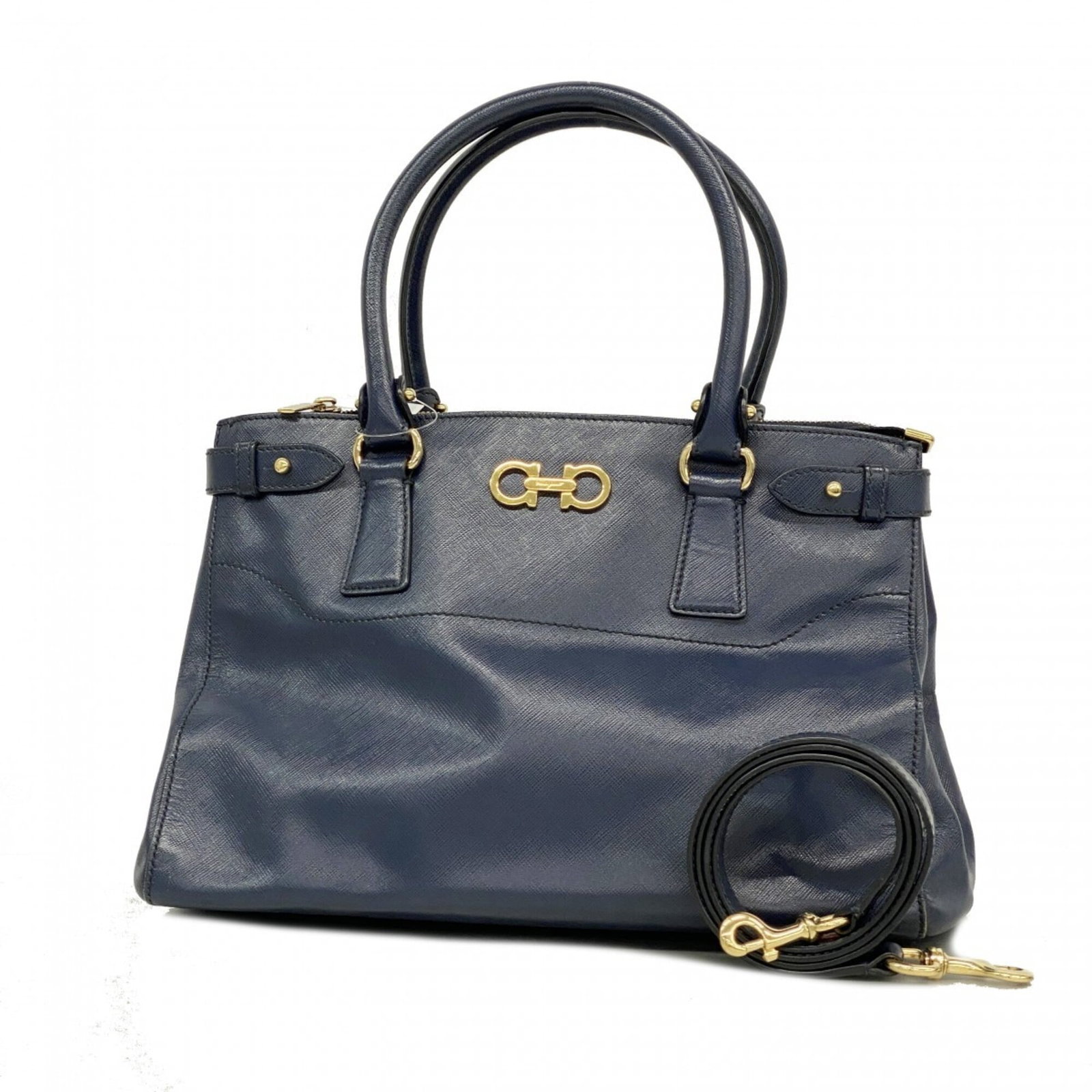 Salvatore Ferragamo Handbag Leather: Salvatore Ferragamo Handbag Leather Navy leather handbag from Salvatore Ferragamo, featuring gold hardware and a classic design. Made from high-quality leather, this timeless piece is a stylish