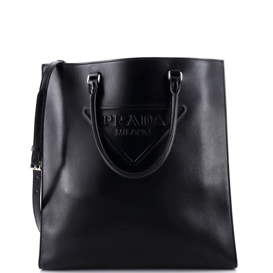 Triangle logo convertible medium leather open tote by Prada: Triangle logo convertible medium leather open tote by Prada Black medium leather triangle logo convertible open tote by Prada, featuring a sleek design with a convertible strap and minor corner wear,