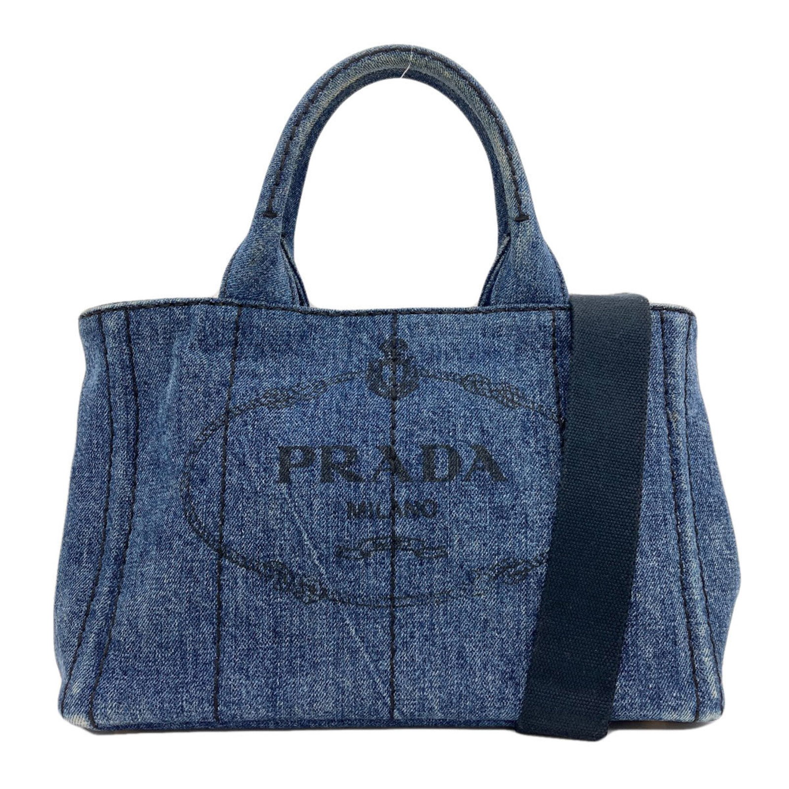 Handbag Denim Prada: Handbag Denim Prada Denim Prada handbag boasts a striking blue hue and a unique denim material. Measuring 19cm x 28cm x 16cm, this stylish bag is a compact and portable accessory. Item Specifics: Bran