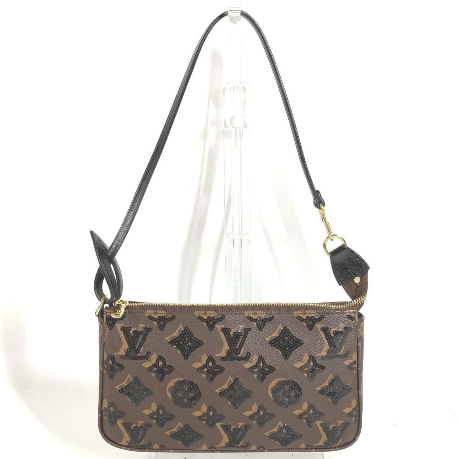 Monogram Canvas Louis Vuitton Shoulder Bag: Monogram Canvas Louis Vuitton Shoulder Bag Monogram Canvas Louis Vuitton Shoulder Bag. This brown, monogram canvas shoulder bag features the iconic Louis Vuitton design. Made from high-quality