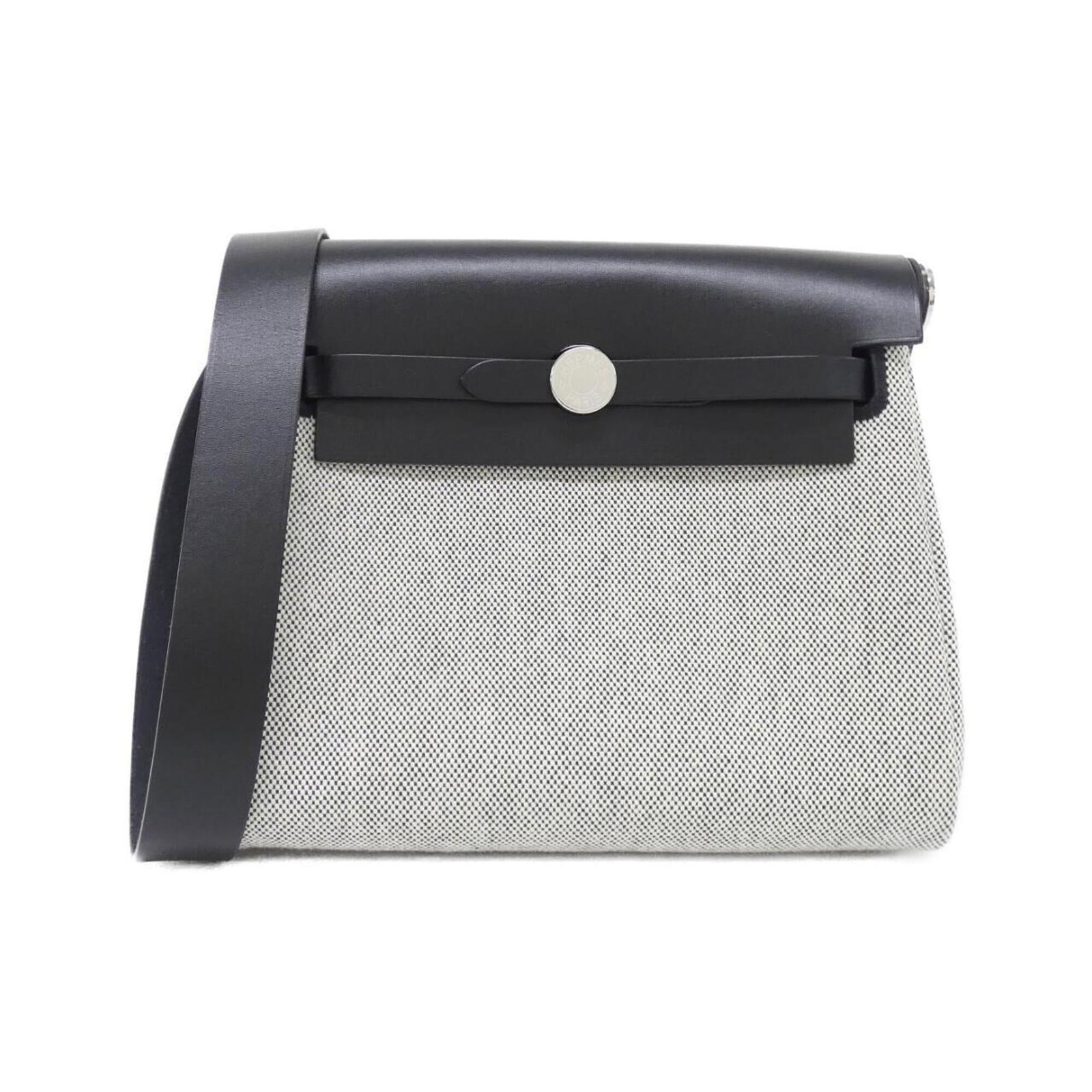 Shoulder Bag By Hermes: Shoulder Bag By Hermes Black and Ecru Hermes Shoulder Bag - A Timeless Design. This sleek shoulder bag features a classic design with a black and ecru color combination, silver hardware, and a
