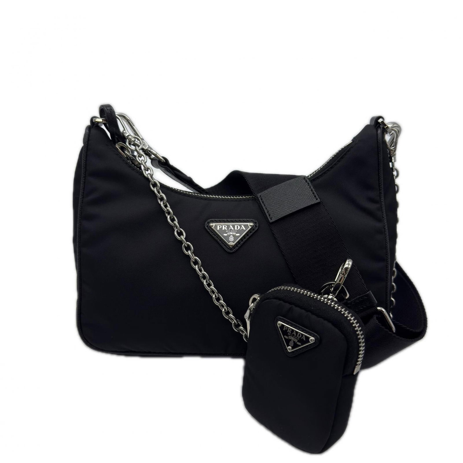 Shoulder Bag Nylon Leather Prada: Shoulder Bag Nylon Leather Prada Saffiano leather makes up the exterior of this black shoulder bag, a key feature of Prada's iconic design. The bag's compact size, measuring 12cm x 22cm x 6cm, makes i