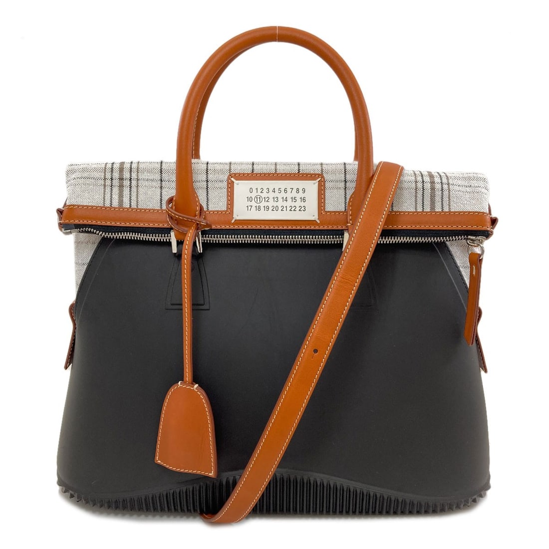 Maisonmargiela 5Ac 2Way Handbag Rubber Canvas: Maisonmargiela 5Ac 2Way Handbag Rubber Canvas Black rubber canvas handbag with a 5Ac style from MaisonMargiela, bearing a signature. This unique handbag features a distinctive rubber exterior. Item