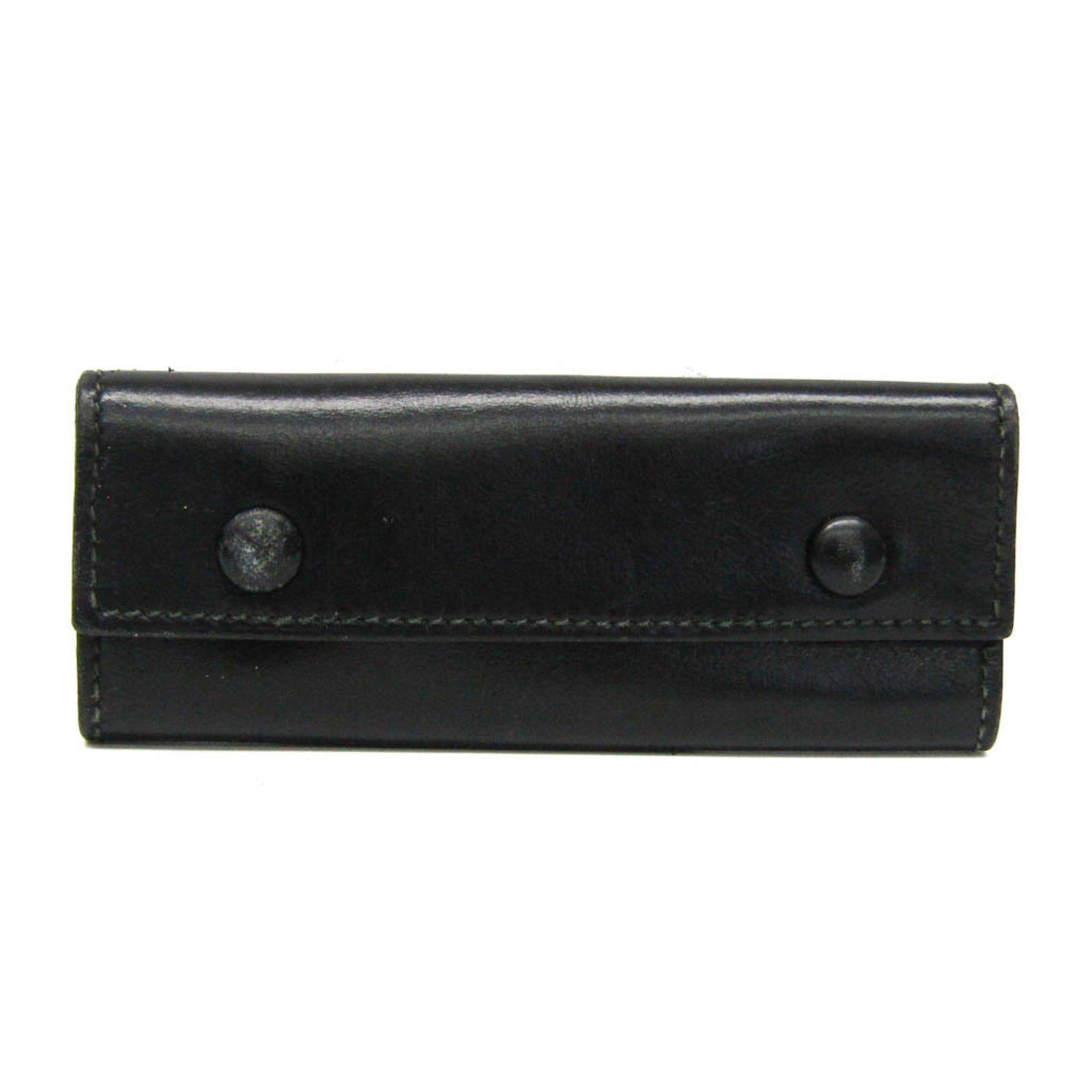Keycase Leather by Hermes: Keycase Leather by Hermes Keycase Leather by Hermes is a sleek and sophisticated accessory, crafted from high-quality black leather. With two secure key hooks, it provides a convenient and organized