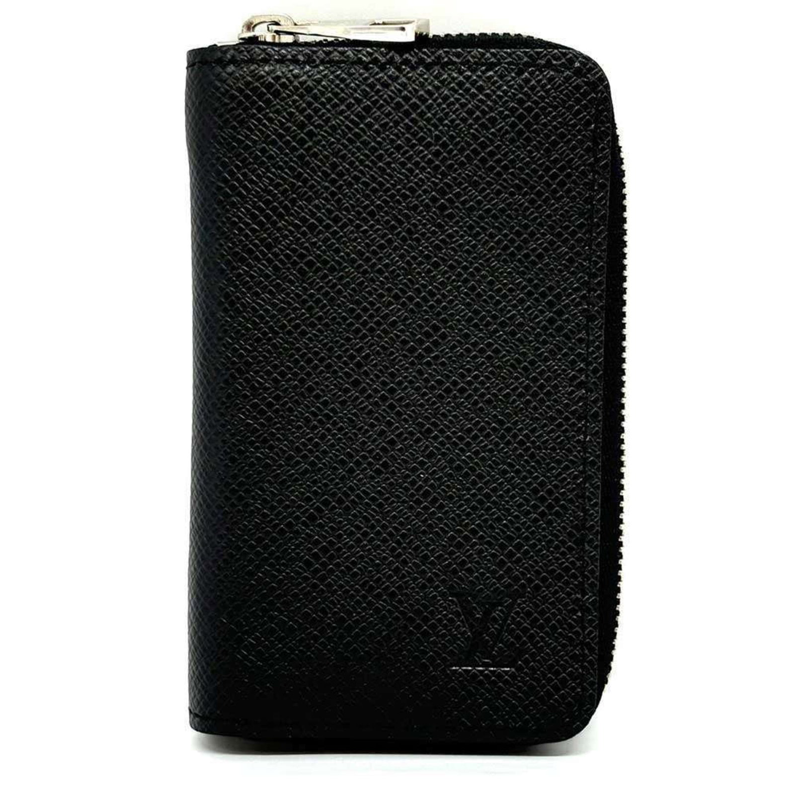 Coin Purse Case Leather Taiga Coin Louis Vuitton: Coin Purse Case Leather Taiga Coin Louis Vuitton Taiga leather provides a rich, textured finish to this Louis Vuitton coin purse case. The case's design and construction showcase the brand's
