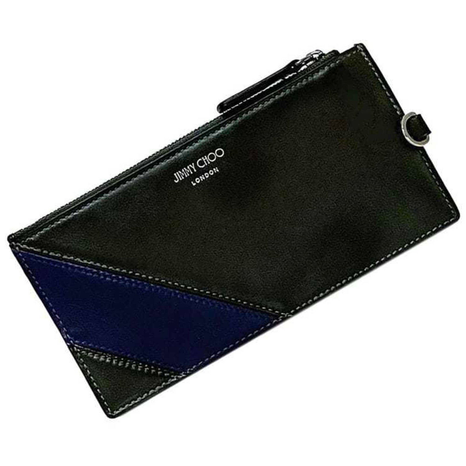 Jimmy Choo Coin Purse/ Coin Case Leather: Jimmy Choo Coin Purse/ Coin Case Leather This khaki or navy leather coin purse features a zipper closure and an inner pocket with card slots and a single pocket. Made from high-quality leather, its cl