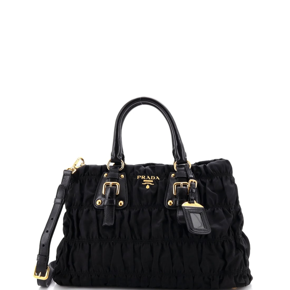 Convertible Tote Leather Gaufre Prada Large Tessuto: Convertible Tote Leather Gaufre Prada Large Tessuto Black Prada Gaufre Convertible Tote features a durable leather exterior with a convertible design, allowing for multiple carry configurations. The l