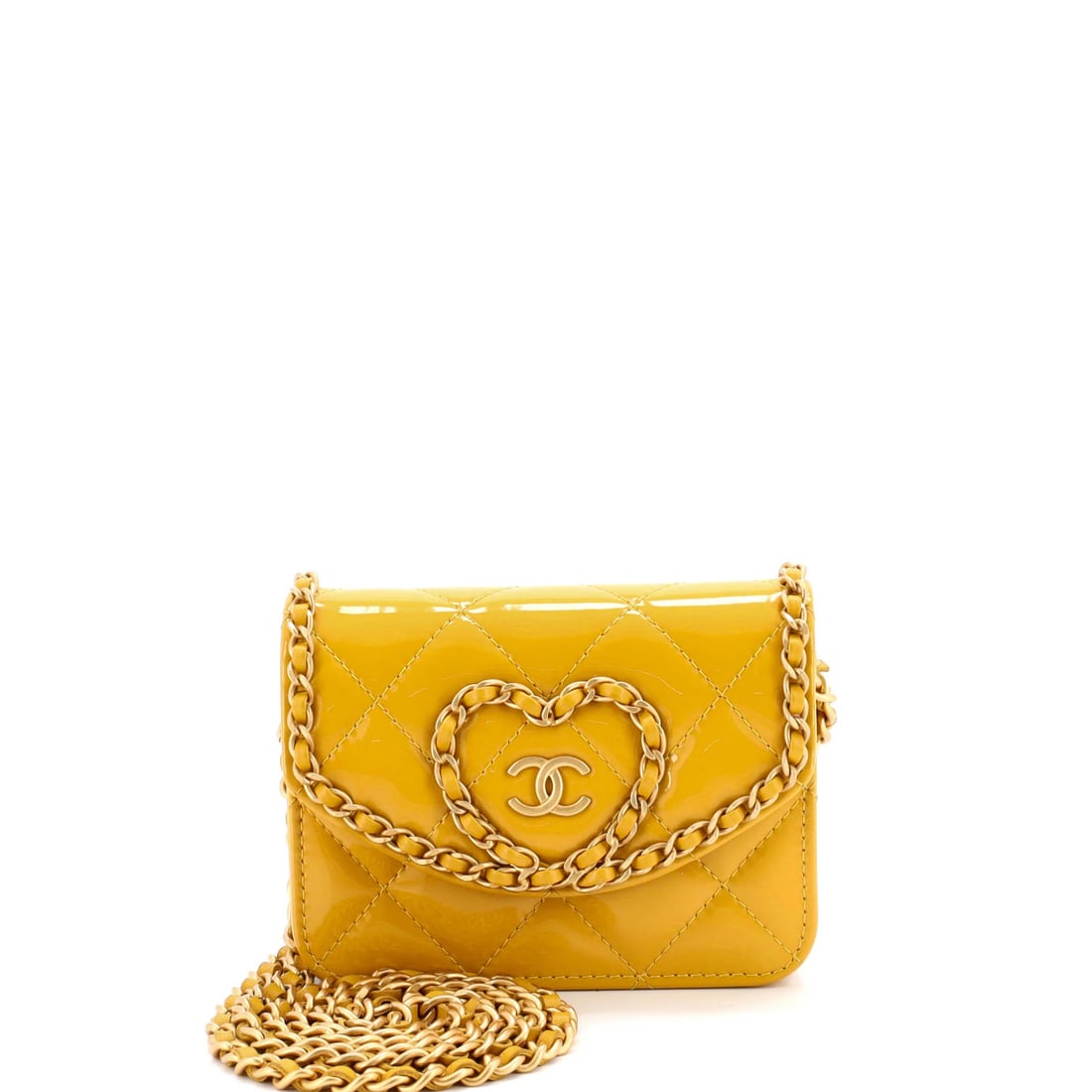 Quilted Patent Bag Mini Chain Heart Chanel: Quilted Patent Bag Mini Chain Heart Chanel Yellow quilted patent leather mini cross body bag with a heart chain flap, featuring a classic Chanel design. The bag's exterior shows minor scuffs and