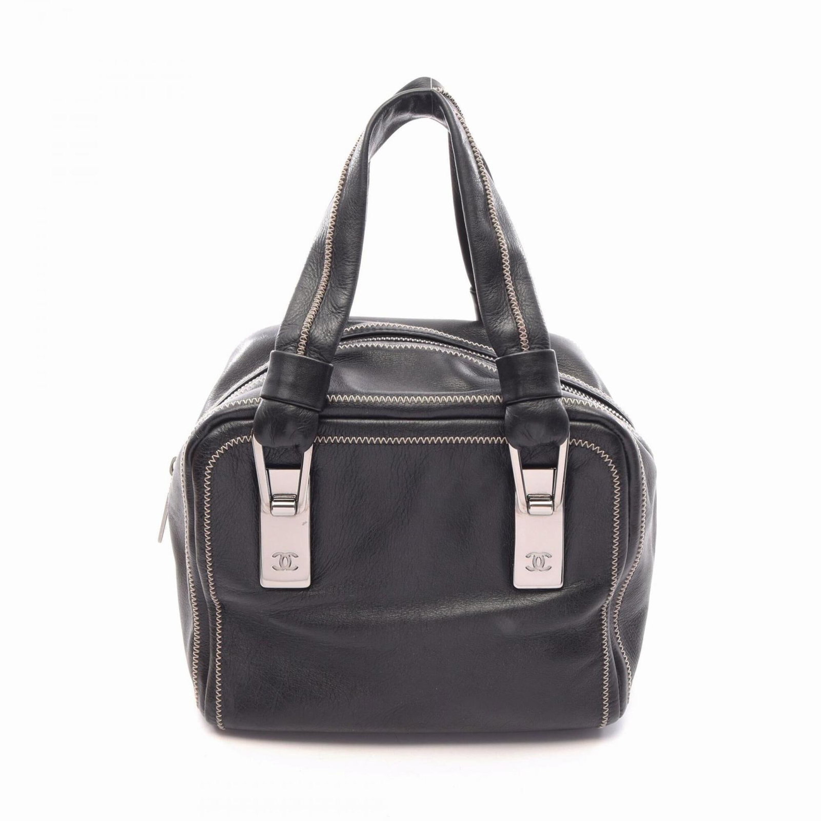 Handbag Leather from Chanel: Handbag Leather from Chanel This black leather handbag from Chanel features sleek silver hardware, showcasing the iconic brand's timeless design. Made from high-quality leather, its compact size