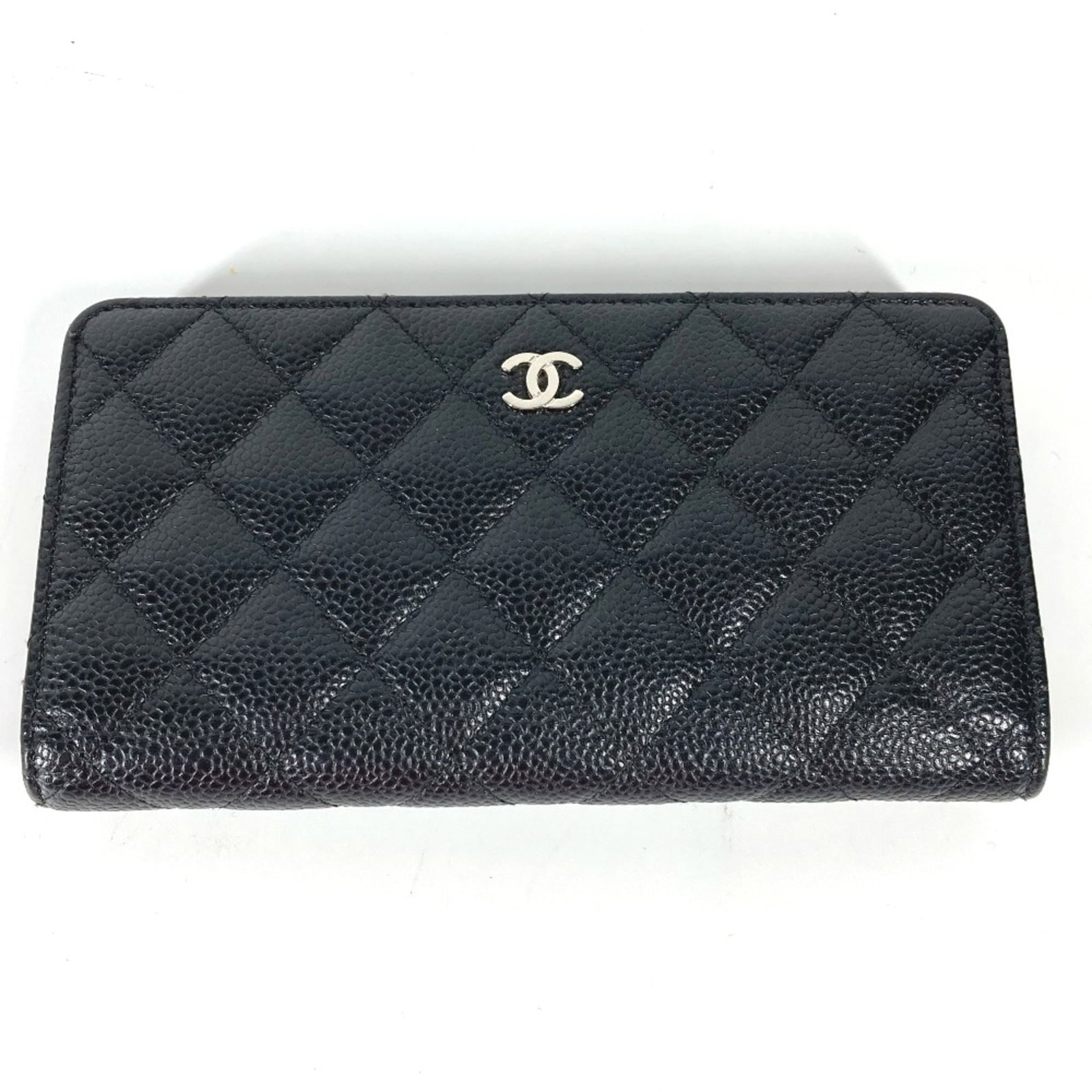Chanel Long Wallet (Bi-Fold) Leather: Chanel Long Wallet (Bi-Fold) Leather Black leather bi-fold wallet from Chanel, measuring 18.5cm x 9.5cm and 7.3cm x 3.7cm, bearing a serial number of 2459****. This long wallet features high-quality