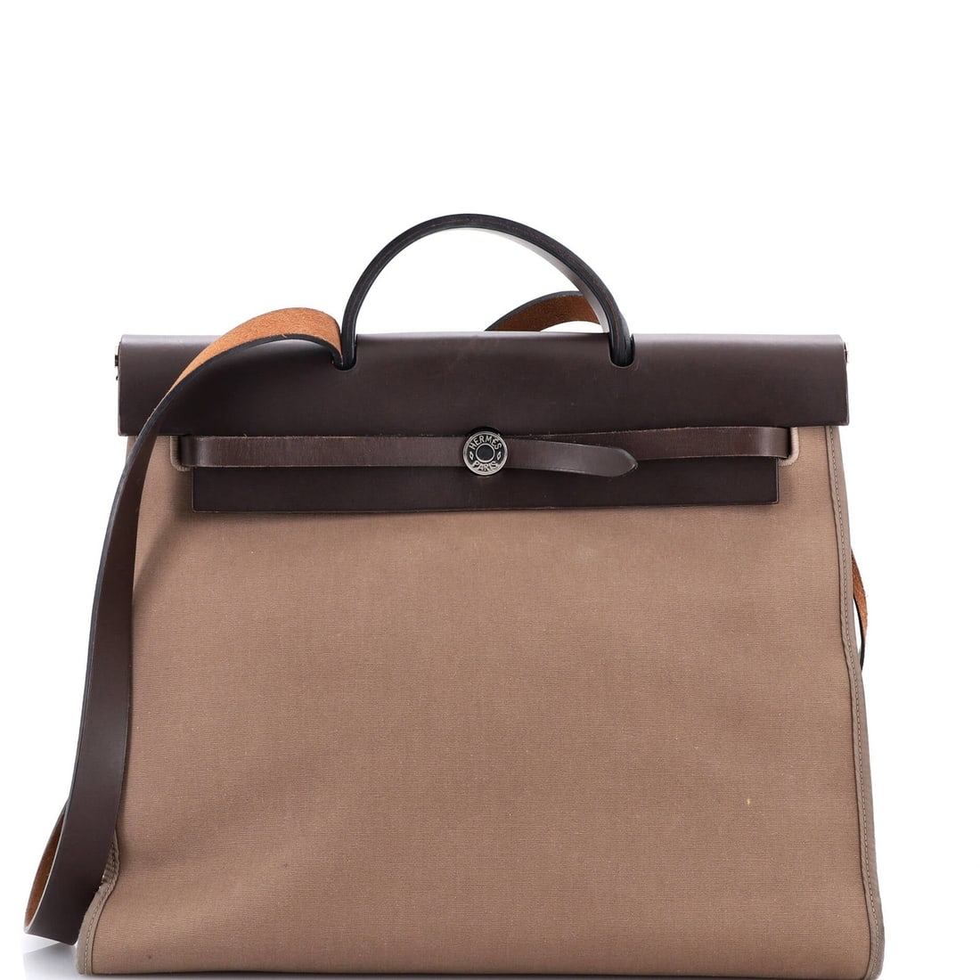Hermes Herbag Zip Leather Toile 39: Hermes Herbag Zip Leather Toile 39 The Hermes Herbag Zip Leather Toile 39 is a stylish and functional handbag featuring a classic top handle design. With its rich brown leather exterior and contrastin