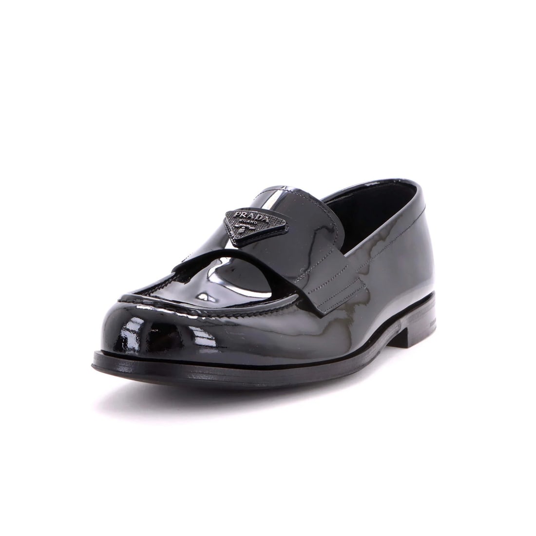 Patent Men's Loafers Logo with Triangle Crystals: Patent Men's Loafers Logo with Triangle Crystals Patent leather loafers with a distinctive triangle logo and crystal accents, adding a touch of sophistication to any outfit. The shoes feature a classi