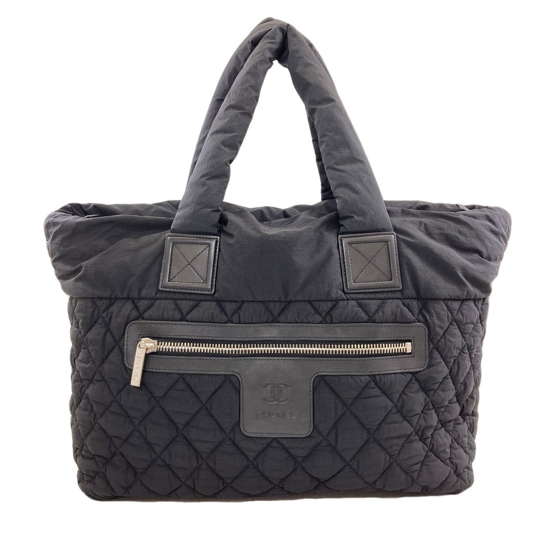 Cocoko Koon Chanel Nylon Tote Bag Silverhardware: Cocoko Koon Chanel Nylon Tote Bag Silverhardware Black Chanel Nylon Tote Bag with Silver Hardware. This black tote bag features a nylon exterior and silver hardware, bearing the iconic Chanel style.