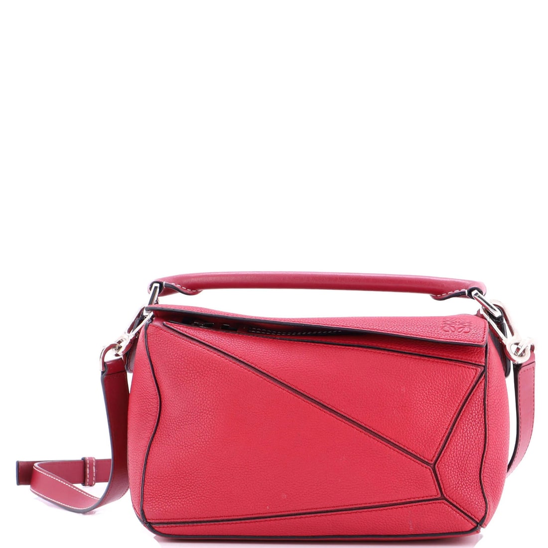 Small Leather Puzzle Bag Loewe: Small Leather Puzzle Bag Loewe Small Leather Puzzle Bag Loewe in Pink Features a classic satchel design with a small size and adjustable strap, perfect for carrying essentials. The exterior is made