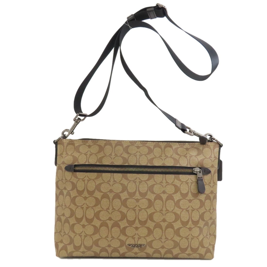 Signature Shoulder Bag Pvc Coach: Signature Shoulder Bag Pvc Coach Signature PVC Coach bag in brown exterior, featuring a stylish shoulder design. The bag's exterior is made of PVC material, a durable and water-resistant choice. This