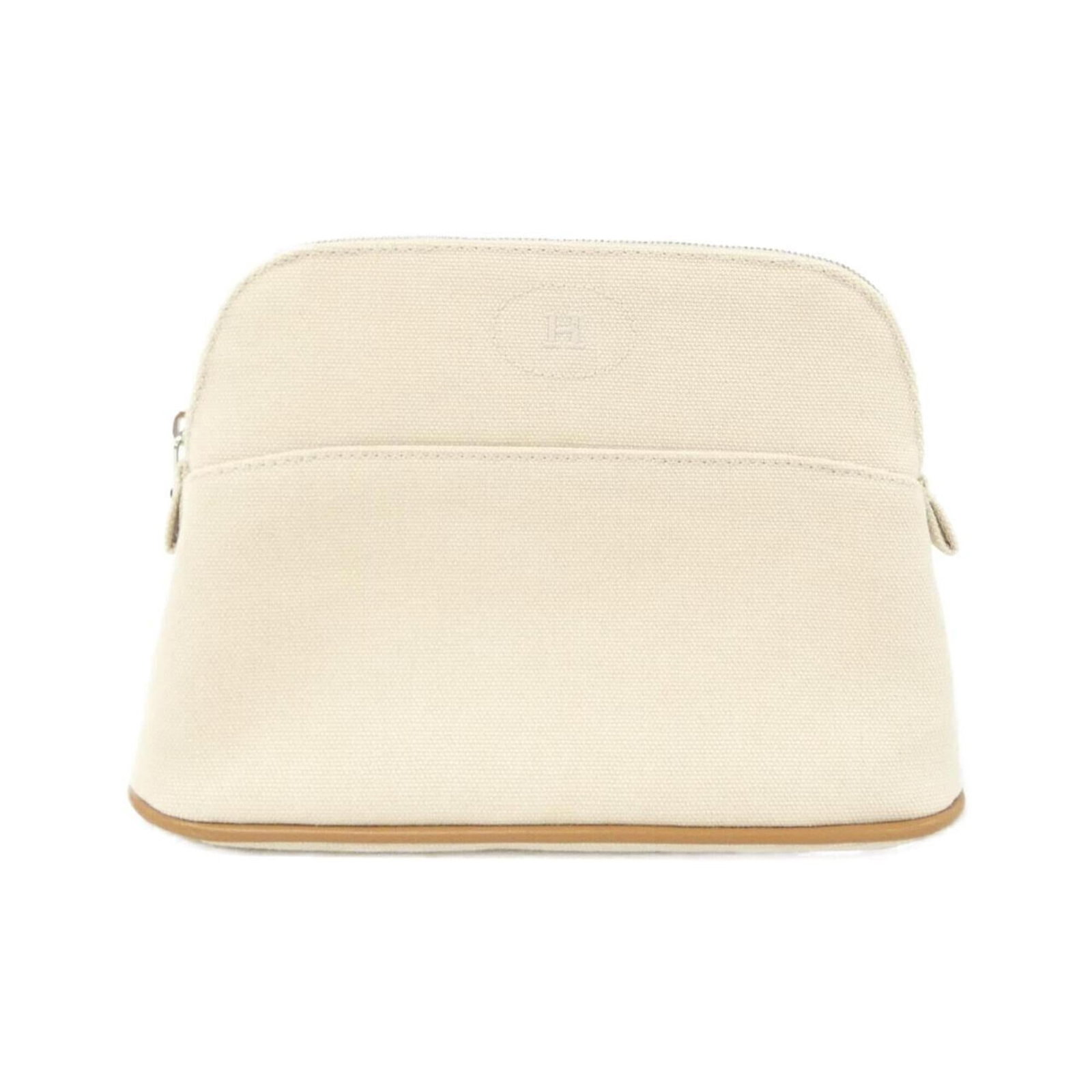 Handbag Canvas Pouch Hermes: Handbag Canvas Pouch Hermes Canvas pouch from iconic brand Hermes, featuring a natural beige color and classic design. Made from high-quality canvas material, this stylish pouch measures 14cm x 20cm